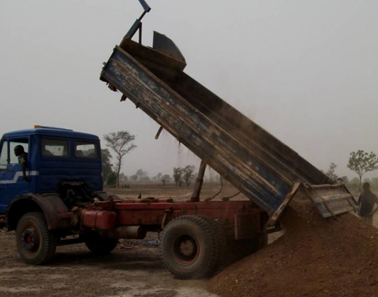 Sand being unloaded from a tipper truck during the building of Pavuu Baptist Primary School, 2010
